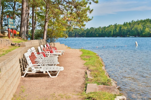 Lakeside resort cabin right on Little Saint with dock, sandy beach, firepit!