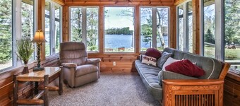 Level lakefront property with spacious cabin, private dock, and fire pit!