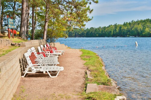 Lakeside resort cabin right on Little Saint with dock, sandy beach, firepit!