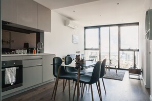 Superior Apartment, Accessible, City View | In-room dining - Victoria One Suites (Melbourne)