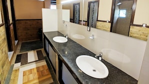 A modern bathroom with two sinks, a large mirror, and a wooden floor. - Hotel Forest Lake Backpackers' Hostel (Pokhara)