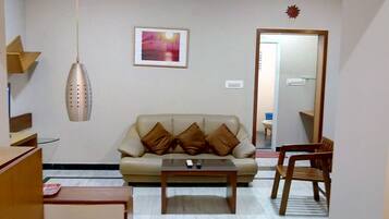 Apartment, 1 Double Bed | Living room | Flat-screen TV