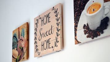 Three wooden signs with text and decorative elements.