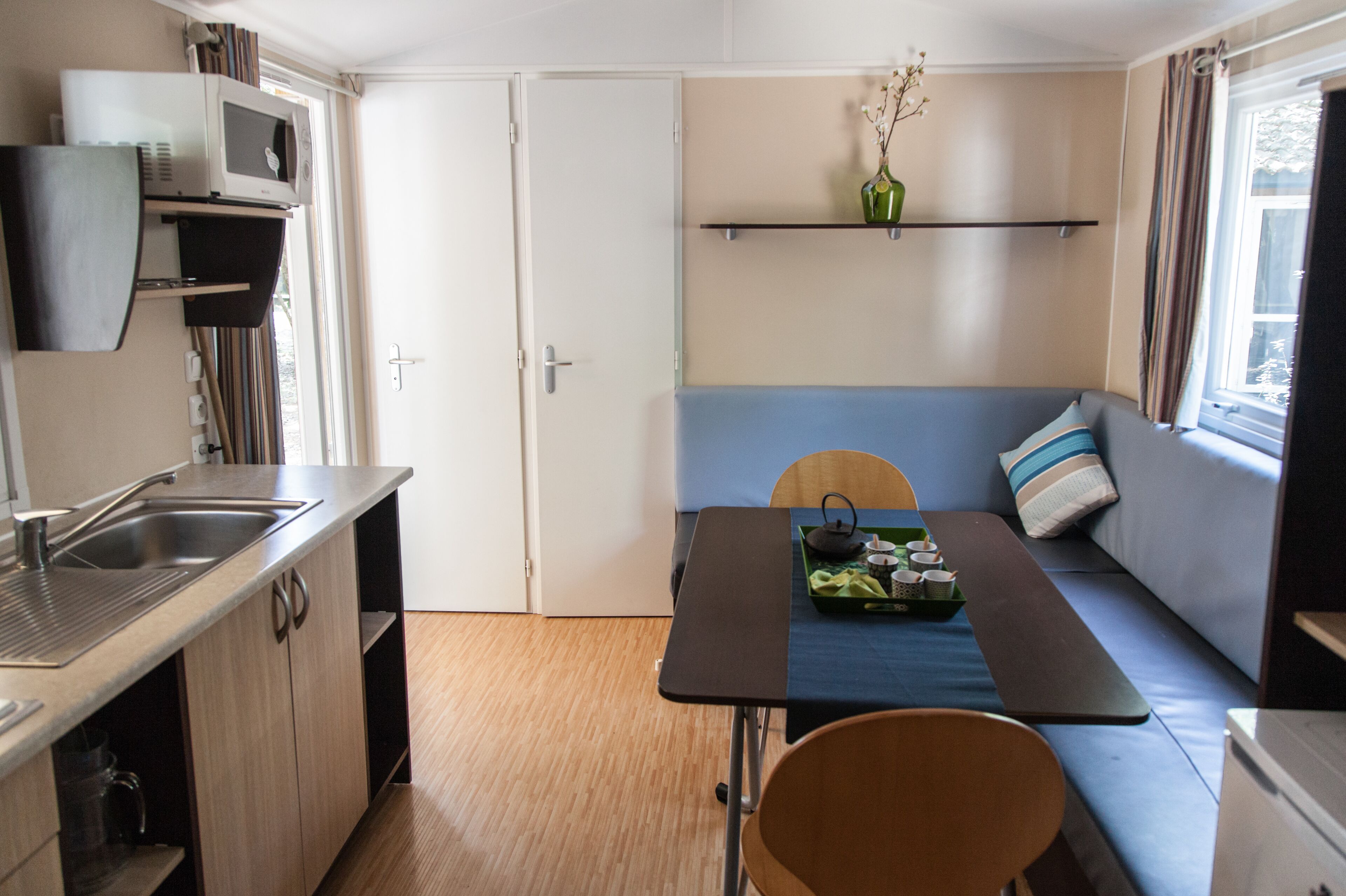 full-sized fridge, microwave, cookware/dishes/utensils