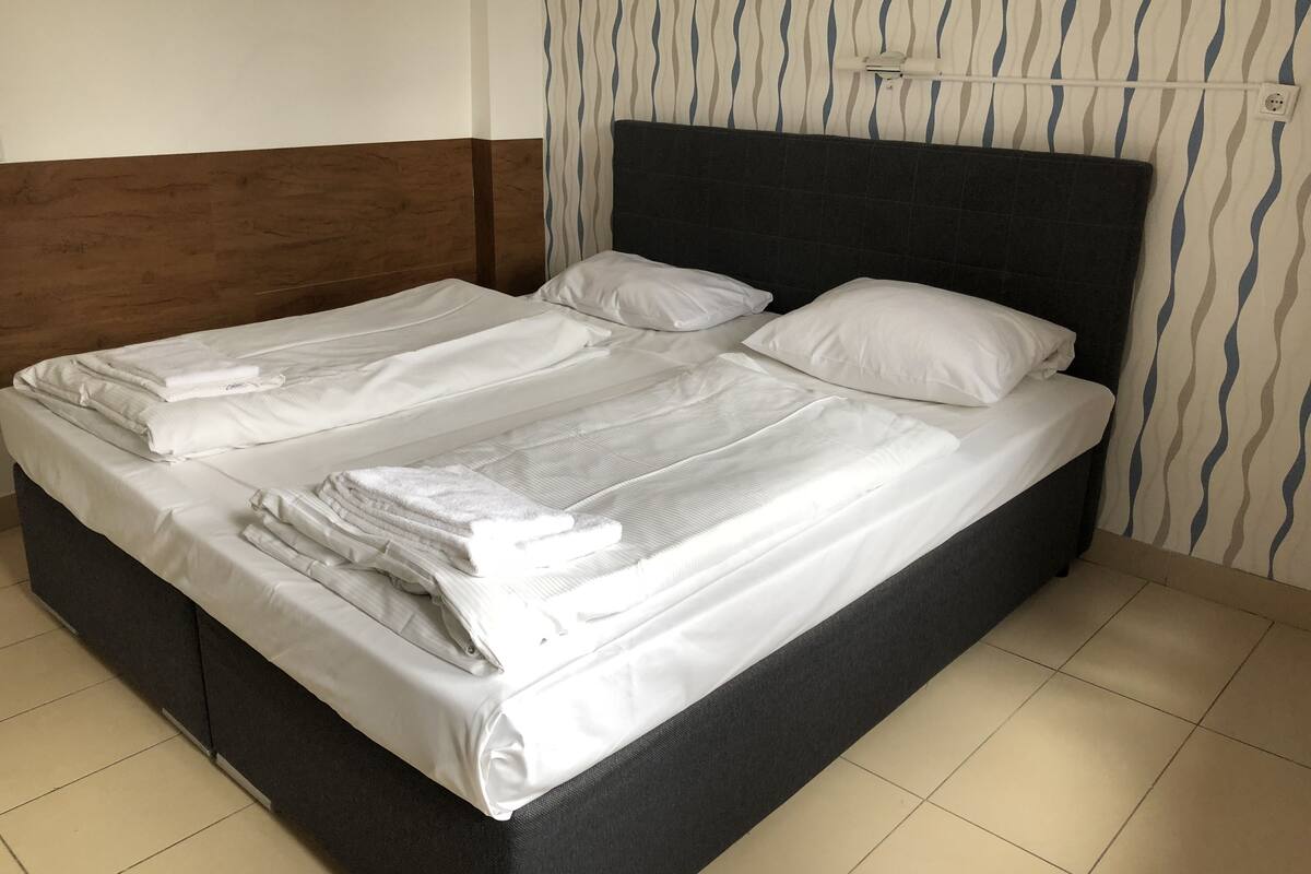 Desk, iron/ironing board (on request), WiFi (free), bed sheets