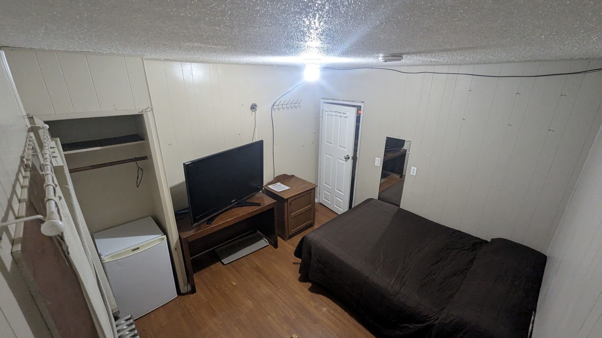 Single room, 1 queen bed (bathroom possibly shared with 2 other guests)