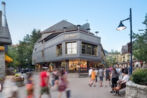 A modern building with a sign reading "Rangea Pod Hotel". - Pangea Pod Hotel (Whistler)