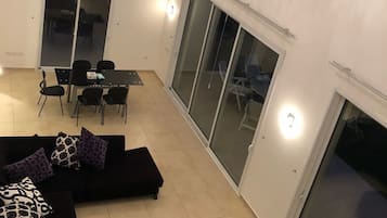 Deluxe Villa, 3 Bedrooms | Living room | Flat-screen TV