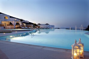Outdoor pool, open 10:30 AM to 7:30 PM, pool umbrellas, pool loungers
