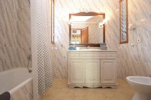 Bathtub, hair dryer, towels