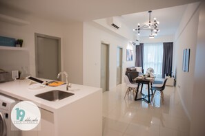 Family Apartment - A, 2 Bedrooms | Living area | 29-inch flat-screen TV with digital channels, TV - 19 Atelier Suites Sutera Avenue (Kota Kinabalu)