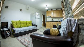 Apartment, 1 Bedroom | Living area | LCD TV