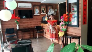 A room with a wooden wall, a television, a desk, and a chair. - Tey Hotel (Pasir Gudang)
