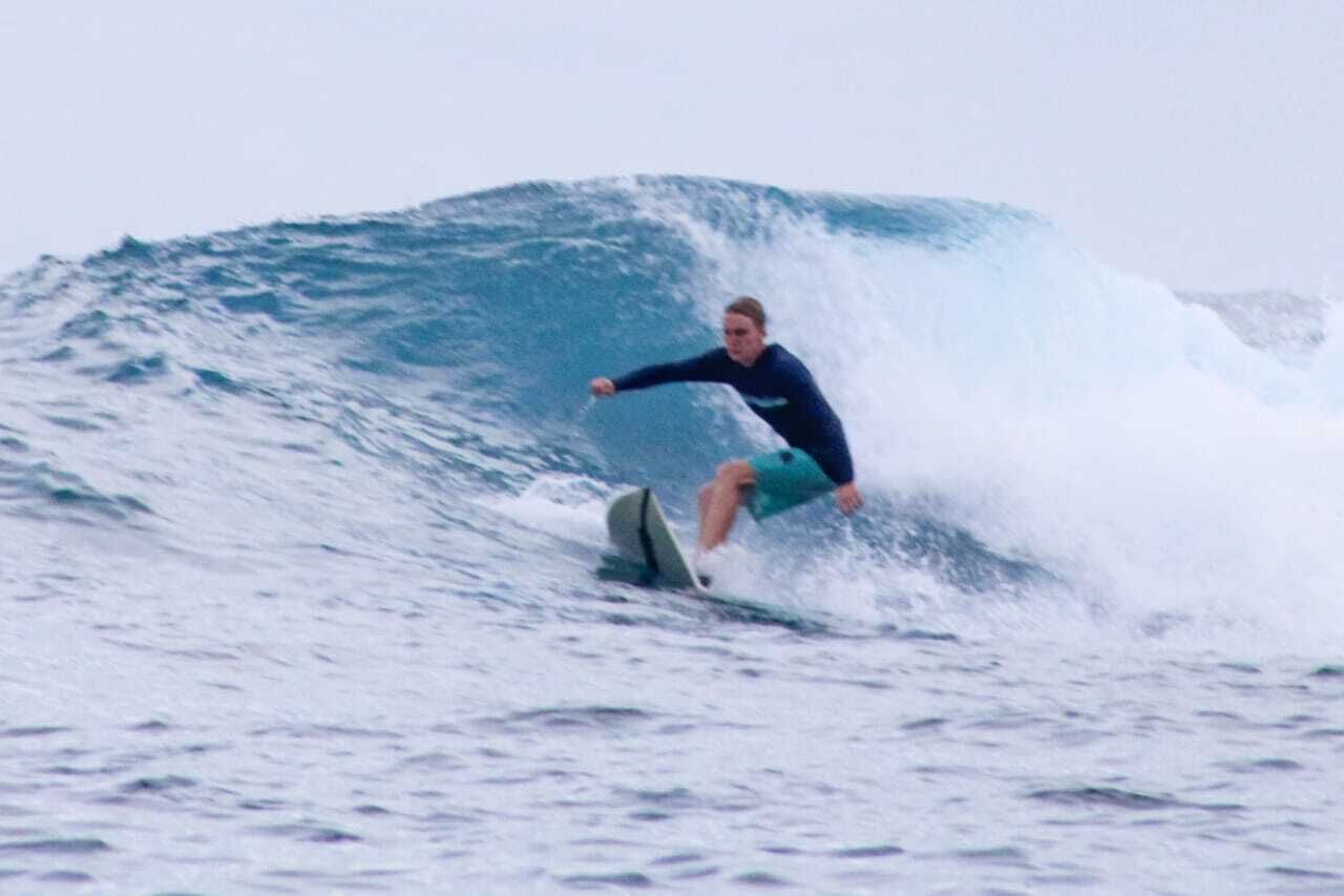 A person surfing a wave.
