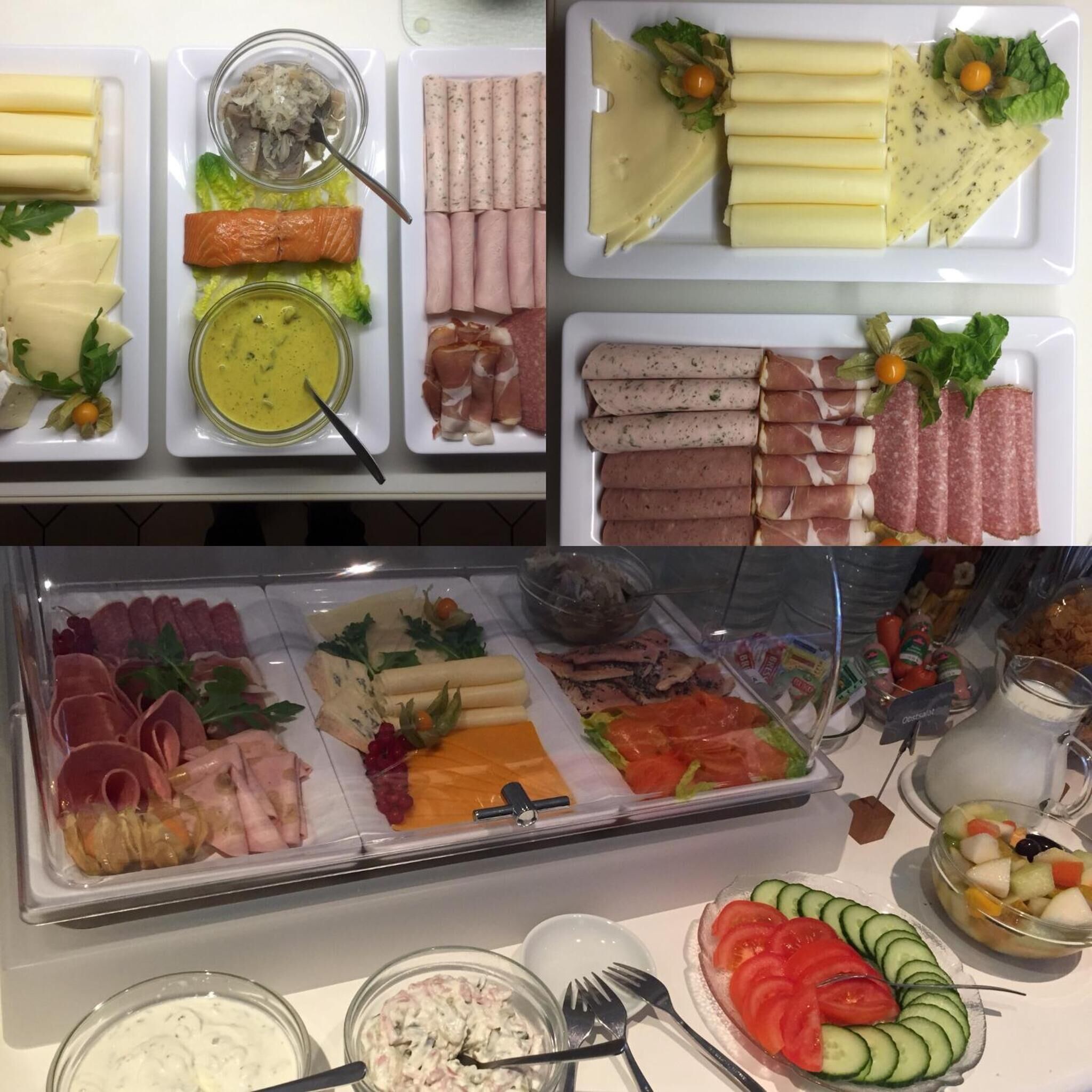 A buffet with various food items including meats, cheeses, and salads.