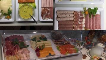 A buffet with various food items including meats, cheeses, and salads.