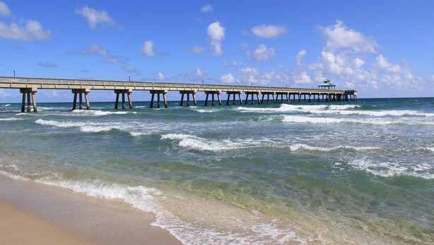 A pier extending into the ocean with clear skies and calm waters. - Deerfield Beach House and Pool
https://my.matterport.com/show/?m=6txjncxb5Lo (Deerfield Beach)