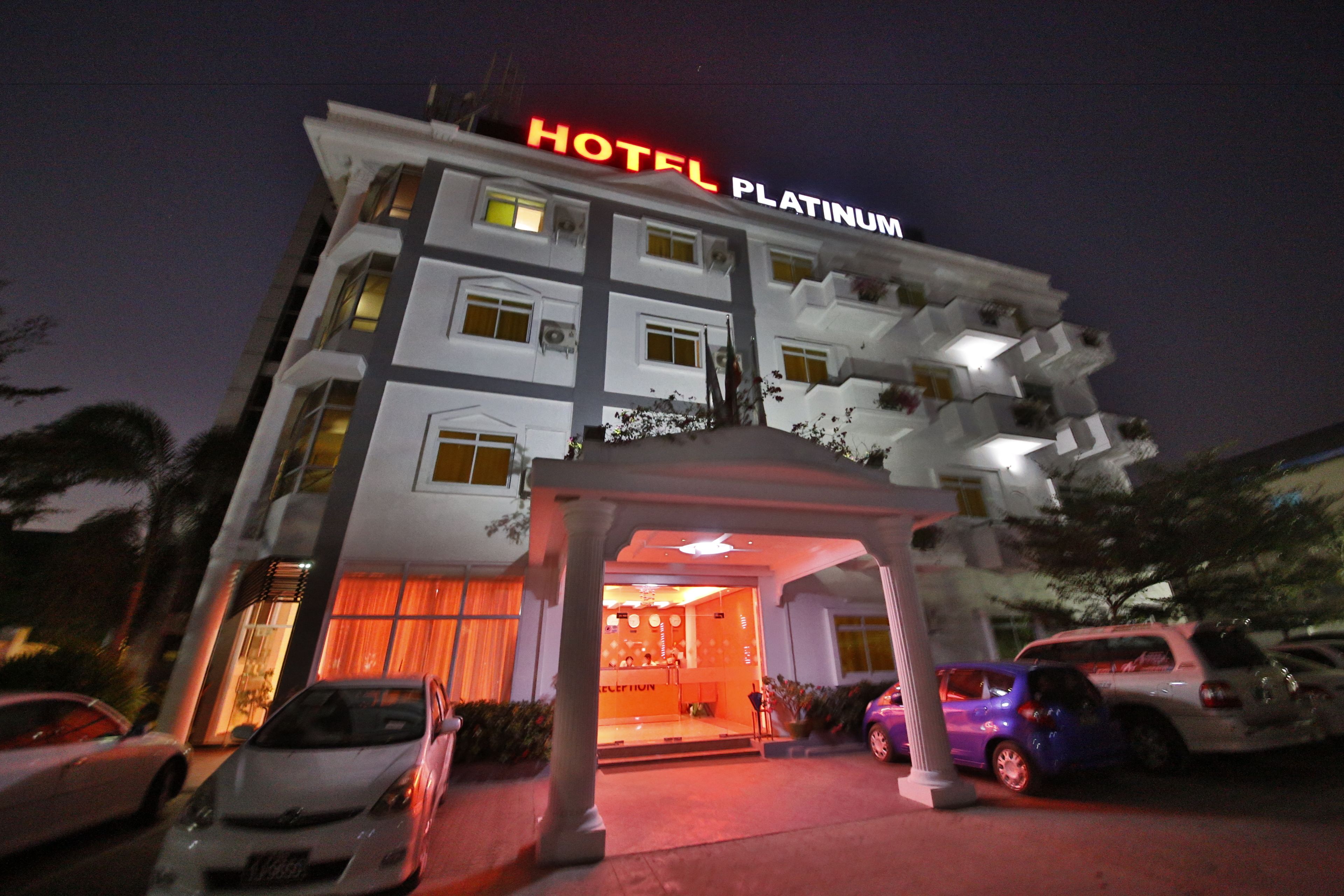 A multi-story hotel with a prominent "HOTEL PLATINUM" sign.