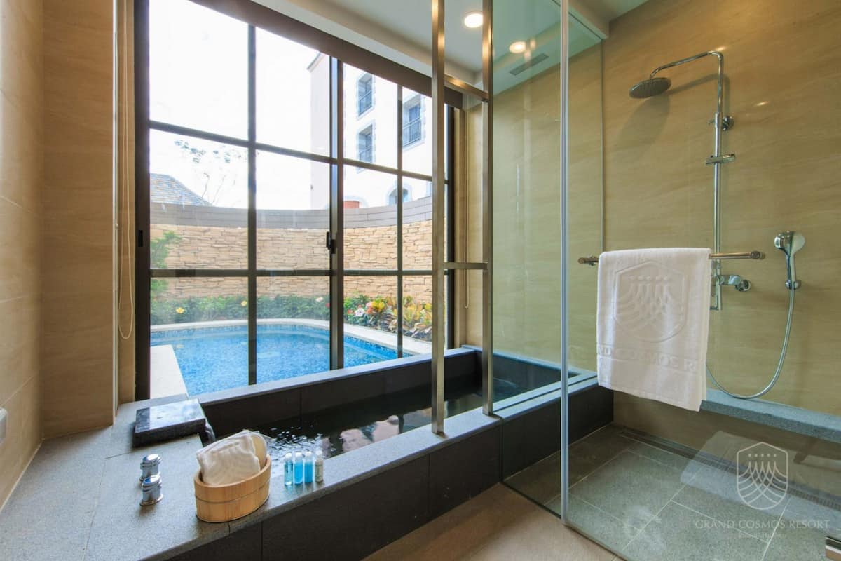 deluxe villa | bathroom | hair dryer, bathrobes, bidet, towels