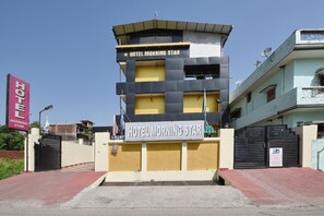 A multi-story hotel named 'Hotel Morning Star' with a prominent sign and a gated entrance. - OYO 4069 Morning Star (Dehradun)