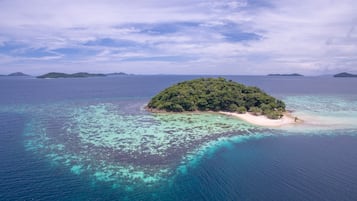 On the beach, white sand, beach towels, beach massages