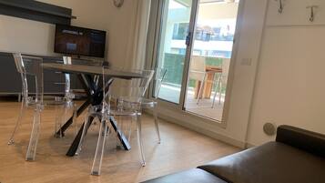 Penthouse, 1 habitación | Área de sala de estar | Televisión de pantalla plana