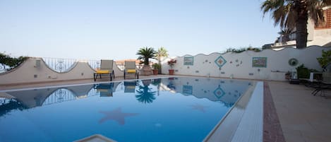 Seasonal outdoor pool, sun loungers