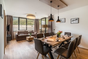 Deluxe Apartment, 3 Bedrooms | Living area | Flat-screen TV, DVD player, heated floors