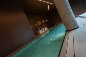 Relax by the pool surrounded by a sleek, contemporary design.