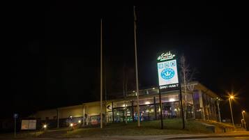 A hotel with a prominent sign for 'Sweden Hotels' and a 'Cafe Cruzzolo' sign above it.