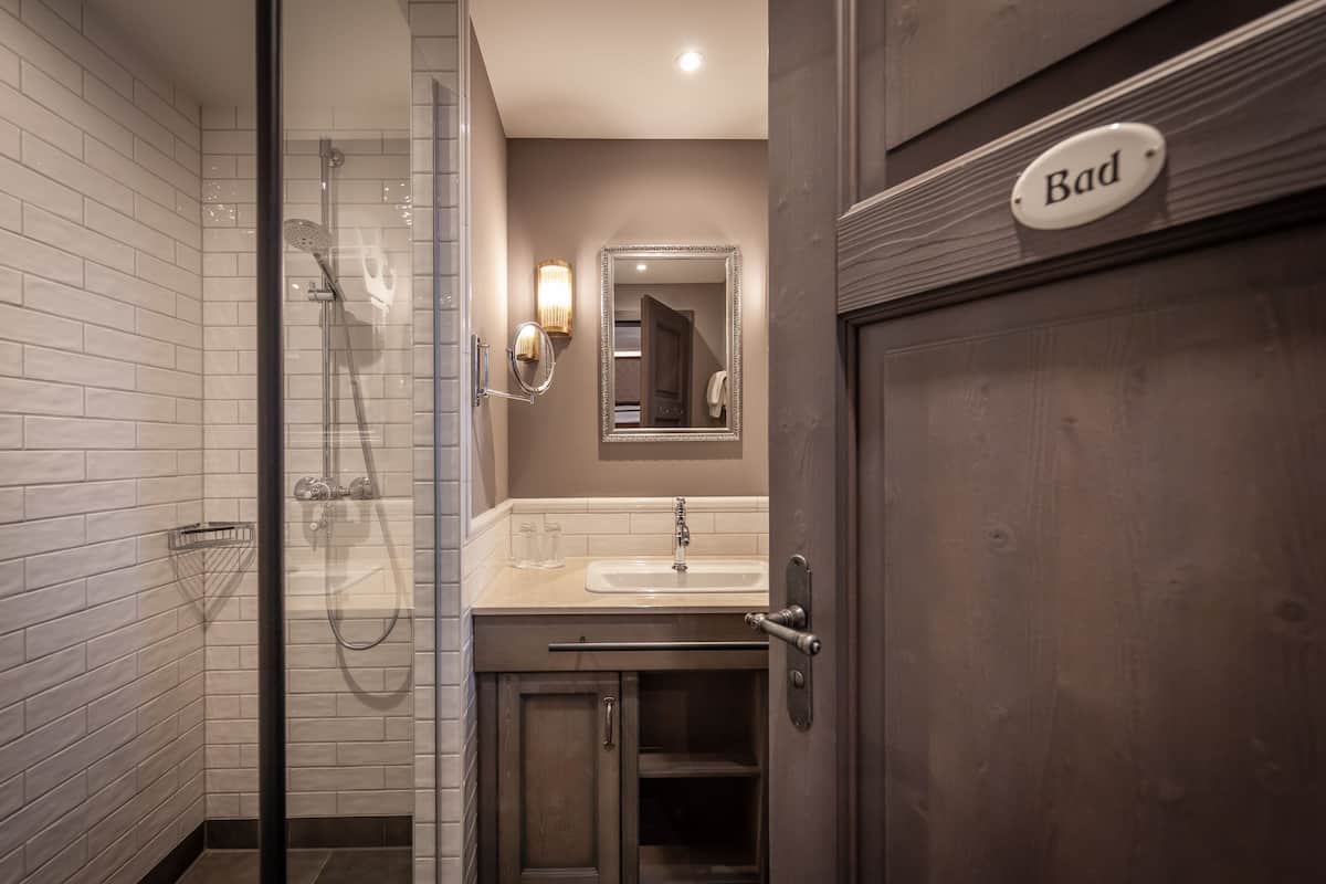 shower, hair dryer, bathrobes, towels