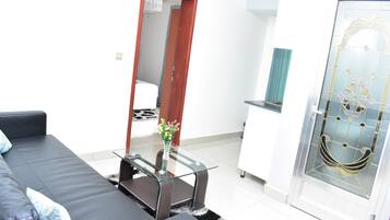 Deluxe Double Room, 1 Queen Bed, Balcony, City View | Living area | Flat-screen TV