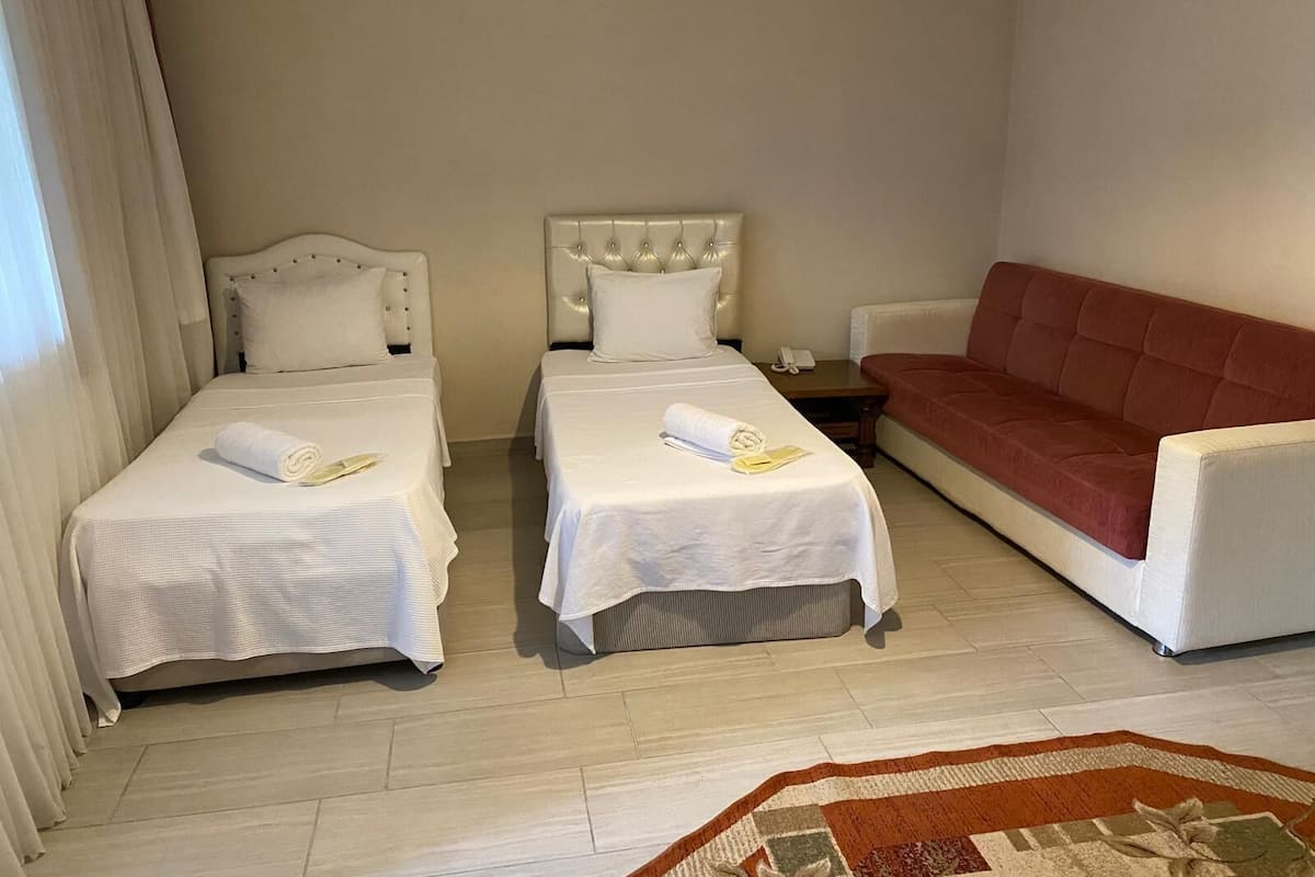 Familie studio suite, 4 slaapkamers | Een kluis op de kamer, gratis wifi, beddengoed