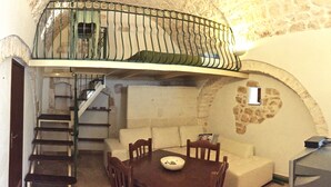 Apartamento, 1 quarto | Área de estar