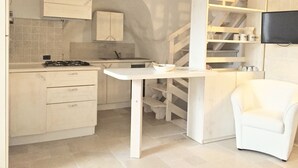 Apartment, 1 Bedroom | Private kitchen | Full-size fridge, stovetop, cookware/dishes/utensils - Giuditta Apartment (Ostuni)
