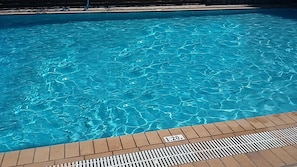 A clear blue pool with a depth marker of 1.20m.