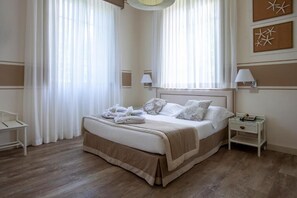 Double or Twin Room | Minibar, in-room safe, iron/ironing board, cots/infant beds