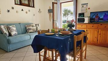 Apartment, 1 Bedroom | Living area | Flat-screen TV, ping pong