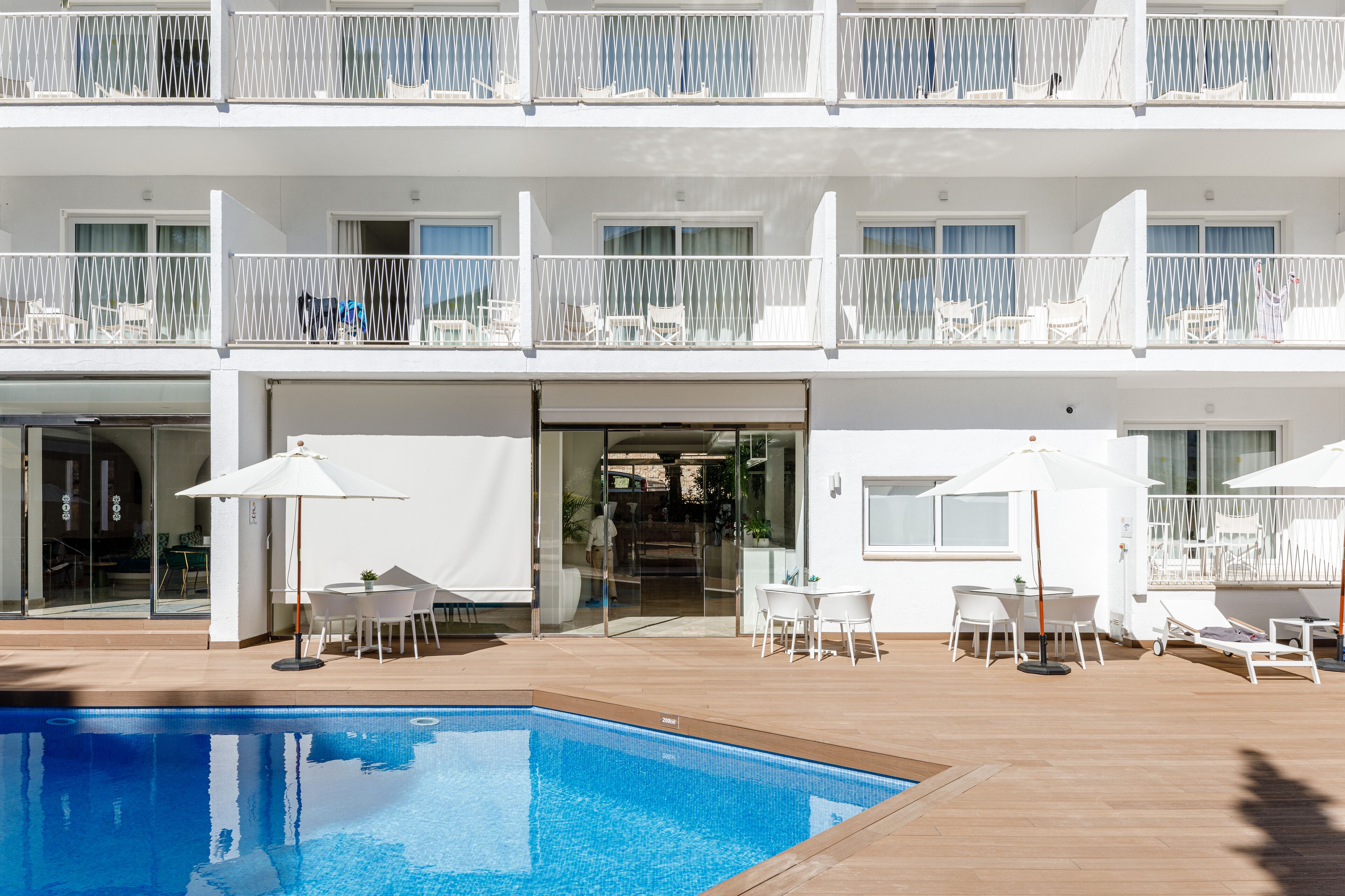 outdoor pool, pool umbrellas, pool loungers