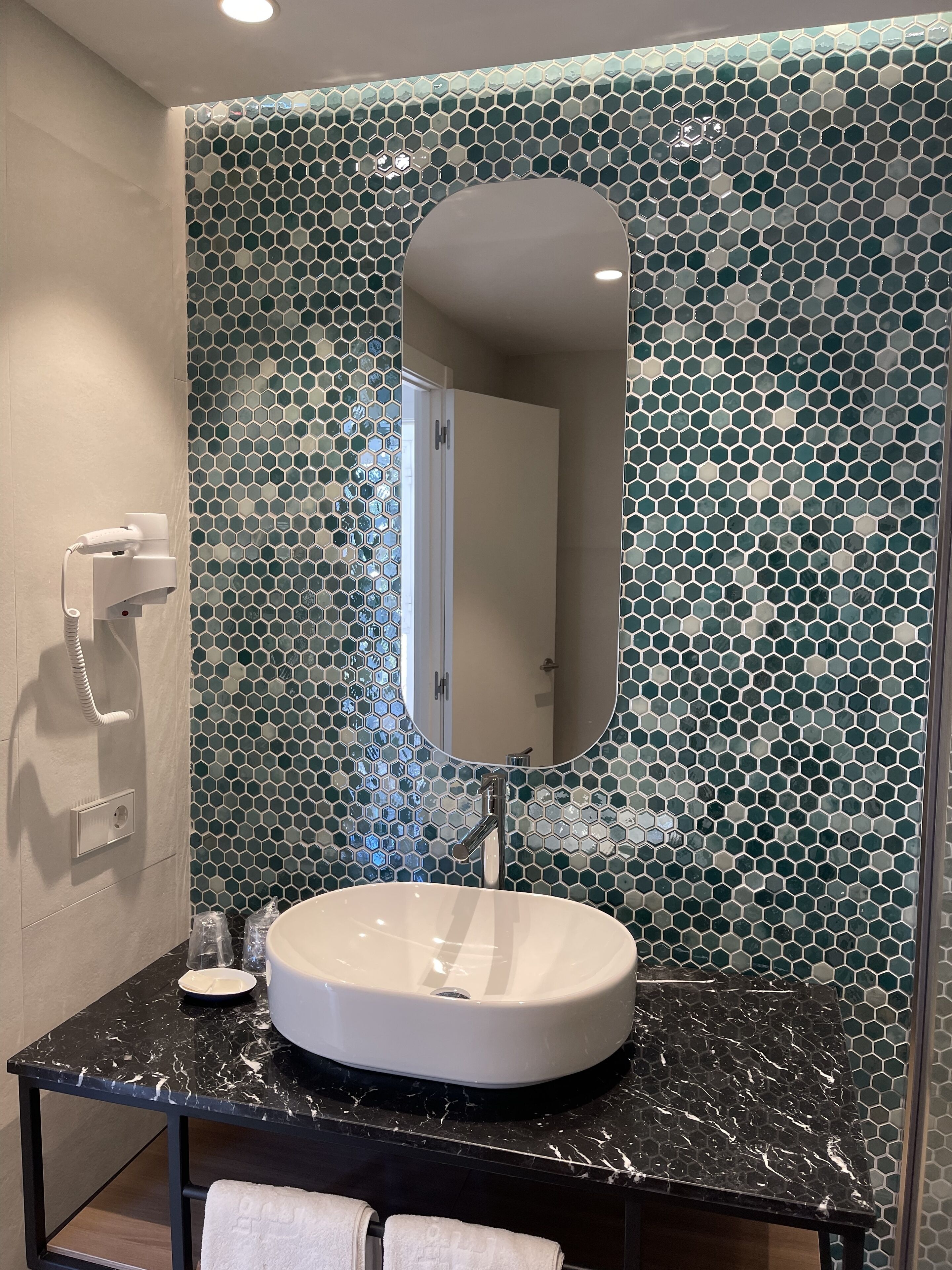 deep-soaking bathtub, free toiletries, hair dryer, towels