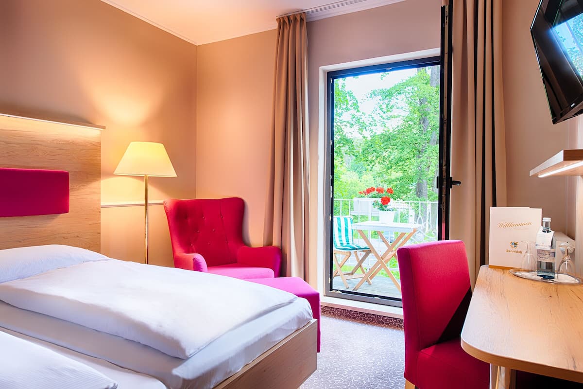 double room, ensuite | living area | flat-screen tv