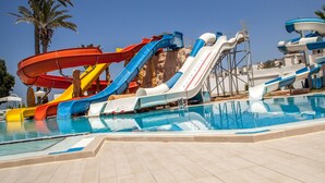 A water park with multiple slides and a pool. - Palmyra Holiday Resort & Spa (Monastir)