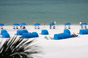 On the beach, sun loungers, beach towels
