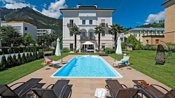 Seasonal outdoor pool, pool umbrellas, sun loungers