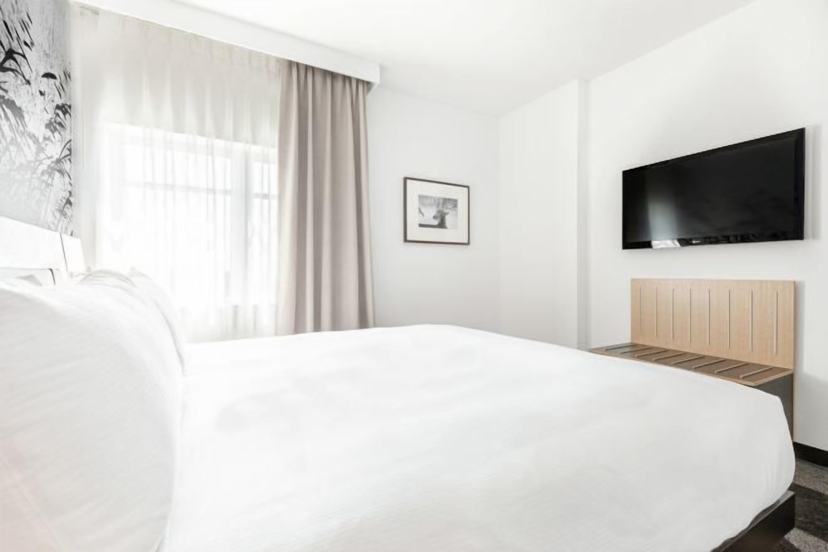 Premium bedding, down comforters, in-room safe, desk