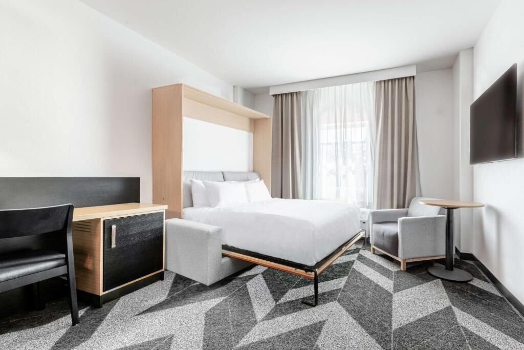Premium bedding, down comforters, in-room safe, desk