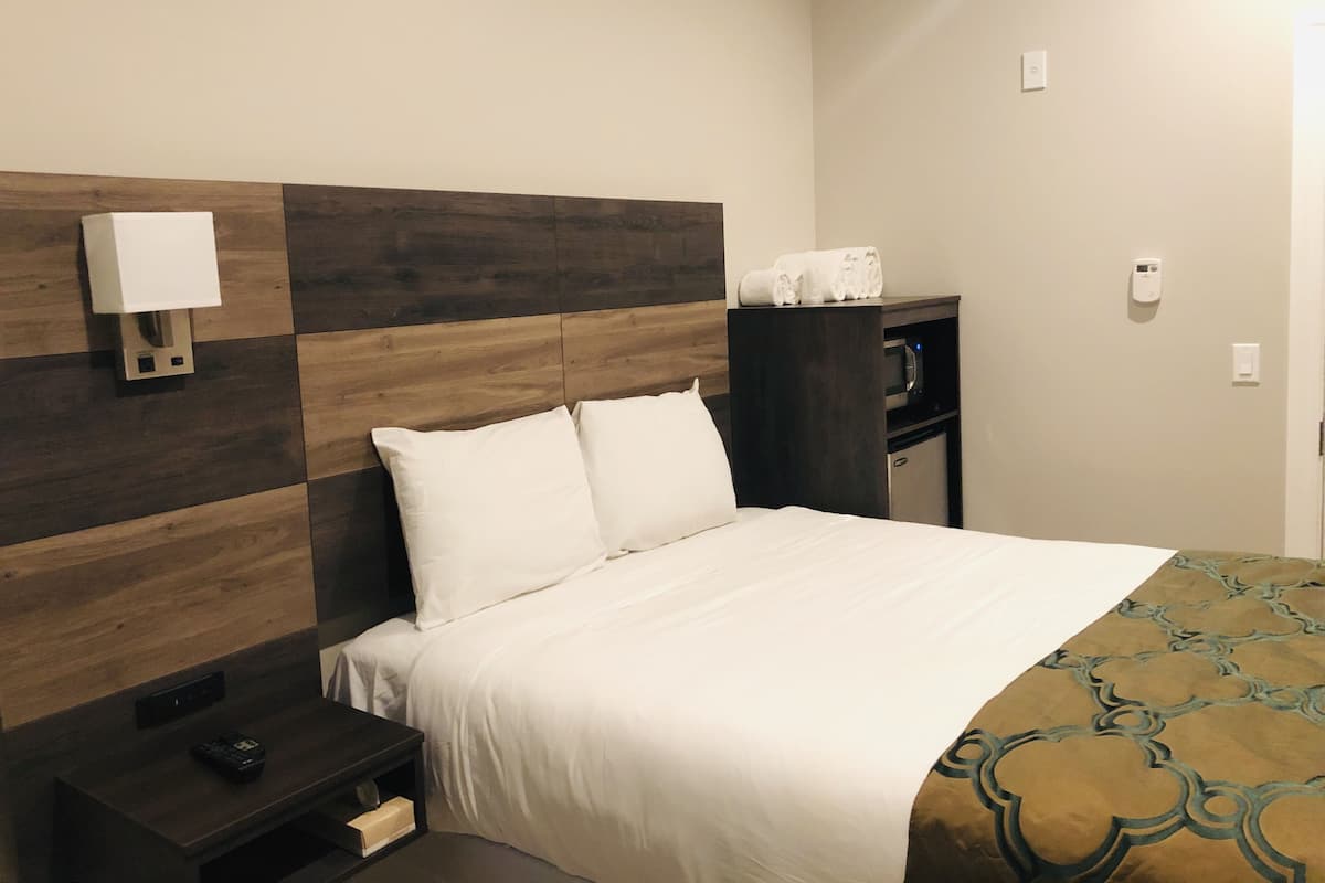 Desk, blackout drapes, WiFi (free), bed sheets