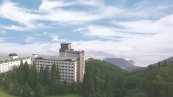 Perched on a hillside, this hotel offers panoramic views of the surrounding landscape amidst lush greenery.