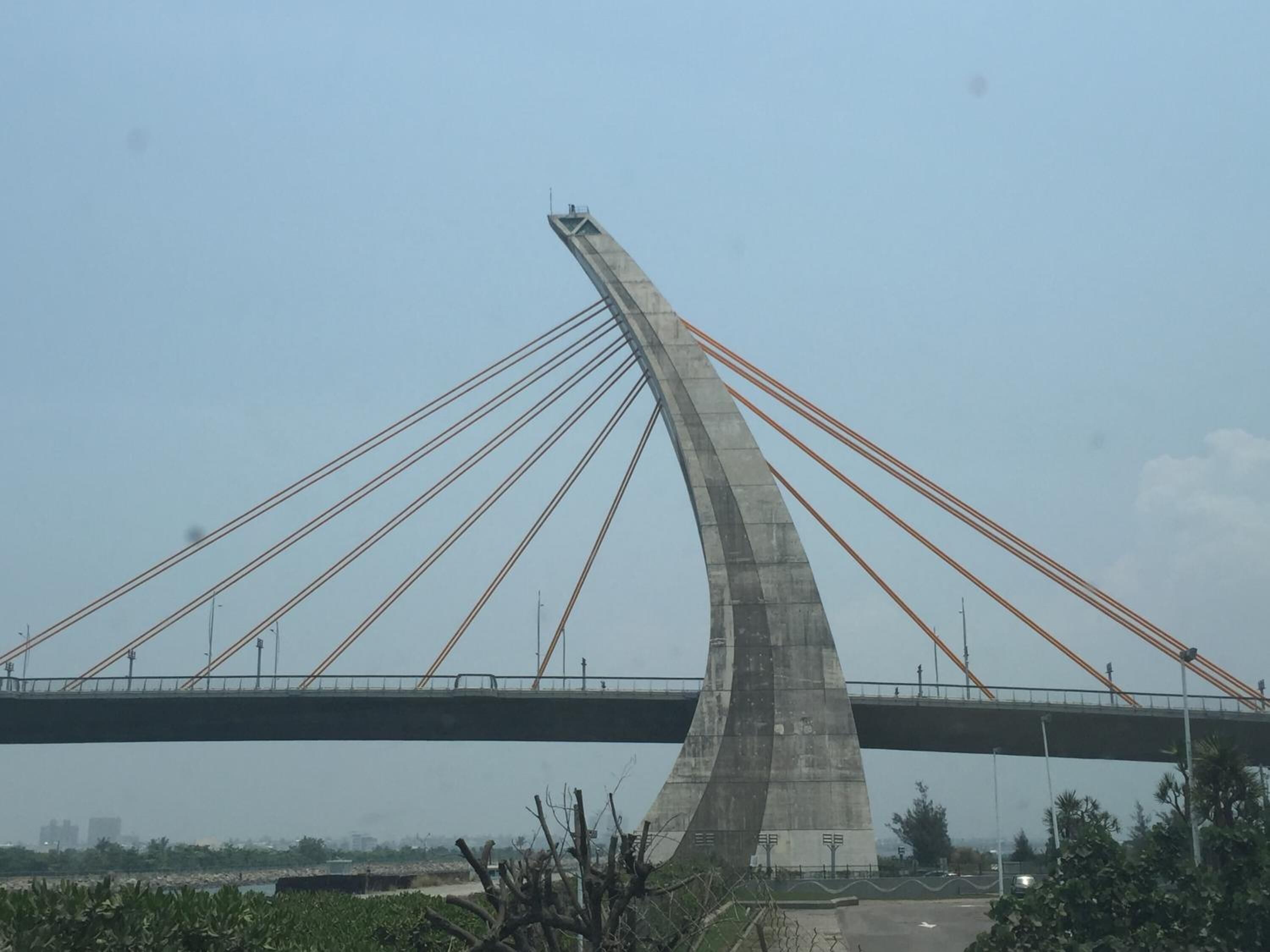 A large, modern bridge with multiple cables supporting the roadway.