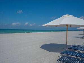 On the beach, sun-loungers, beach towels